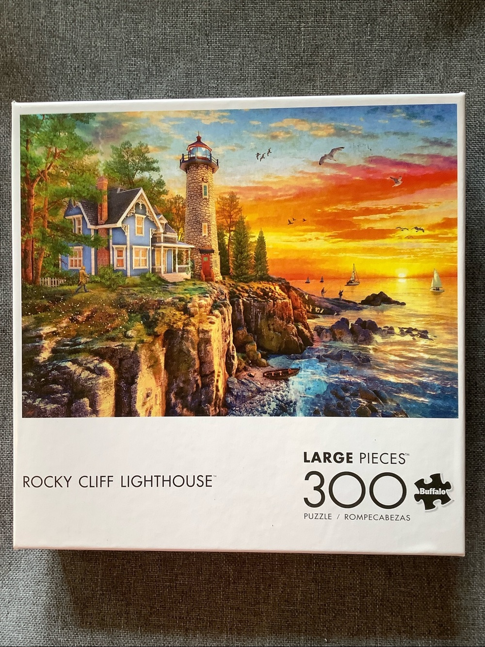 Buffalo Games Rocky Cliff Lighthouse 300 Piece Puzzle
